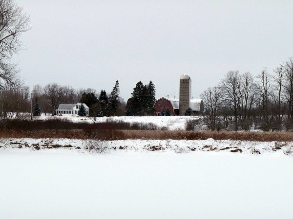 farm across frozen river