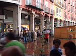 People waiting for the rain to stop during the festivals of Burgos.