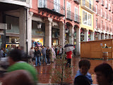 People waiting for the rain to stop during the festivals of Burgos.