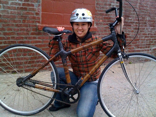 Mai with the bike she made.
