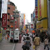 Friday, 6/25: Shibuya - When we left the mall, the rain had stopped. We took a short bus ride to Shibuya. In addition to being Tokyo's top nightlife spot, it's also a great shopping district. For the most part, shopping became unfun for me years ago in the US, as all the little shops I remember from my youth have been replaced by the utter, bland sameness of nationwide chain stores. But Japan is still dominated by small shops, and you never know what you might find in them. One of the shops that is not small, however, is Tokyu Hands, which is just down the road and off camera to the right of this picture. It is the ultimate department store. They simply have everything, and in at least 12 different colors too. After browsing some of the small shops, we spent most of the afternoon in Tokyu Hands.