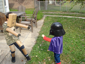Kai in his home made Iron Man costume, battling Eidan in his Spider Man / Darth Vader / Wizard costume