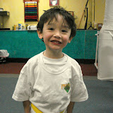 Eidan showing off his new belt at karate graduation