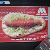 The latest food craze in Tokyo - Indian nan bread, with a hot dog, shredded cabbage, and Japanese curry on it