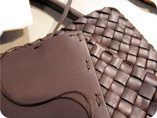 Close up of the hand stitched leather bottom piece of the Ebano Cabat.