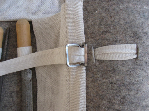 twill tape going through slits cut into the felt