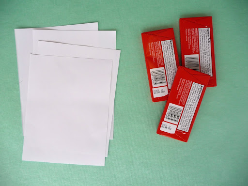 For three 4-1/2-by-2-inch chocolate bars, start with two sheets of 8-1/2-by-11-inch paper, cut in half, then trim about 1 inch off of the short side.