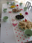 Athena floated small flowers in cupcake papers filled with a bit of water.