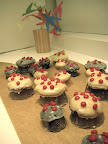 I think Jodi made these adorable mushroom cupcakes- red hots dot the tops.