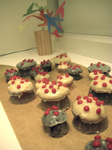 I think Jodi made these adorable mushroom cupcakes- red hots dot the tops.