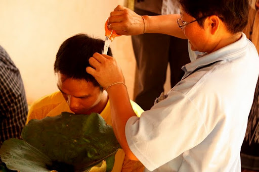 Prayoon has his hair shortened prior to shaved by his family Prayoon, Yoon