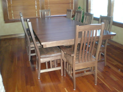 120 x 54 Trestle Table and Raised Mission Dining Chairs in Natural Walnut