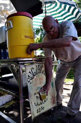 7/11/2010-Bruno Scomazzon pours a cup of icy cold sugar cane juice, which comes with lime and/or ginger.