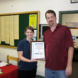 Sabrina from MDA presents Tim from Jewel Lake Bowl with a plaque.