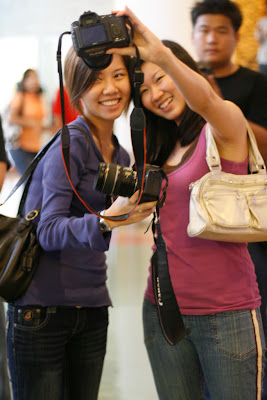 I love this shot, but I find it odd when you take a self shot with a huge SLR camera.