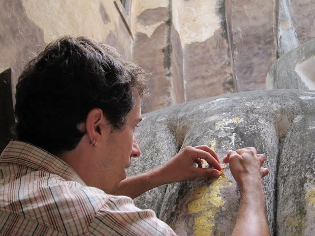 Applying gold leaf