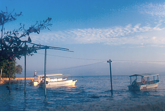 Stock photo a marine scene to the dusk of two fishing boats in the lake of Catemaco, Mexico, color blue, calm