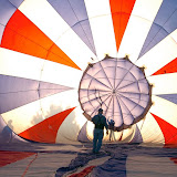 Greg Szymanski of Boisie, Idaho inspects the inside of a partially inflated hot air balloon Wednesday at Mentock Park in Cody. About a dozen pilots are expected to bring their balloons to Cody this weekend for the 13th Annual Wild West Balloon Festival.