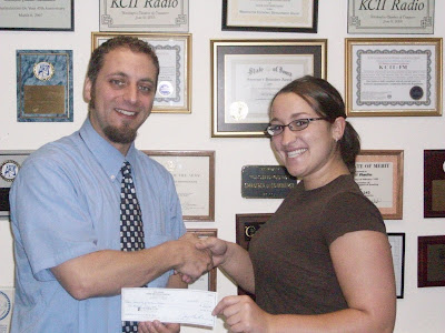 2010 KCII Business to Business Scholarship winner Kristen Hora of Highland High School and General Manager Joe Nichols