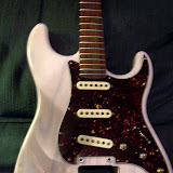 After the pickguard and neck are attached.  Still have to finish up the input jack at this point.  Not the best photo, sorry.