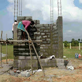 Umapati and Narayan cementing the blocks.jpg