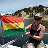 Dee and the Bolivian flag on the slow, slow boat back