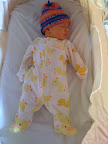 I'm including this photo as this is how Audrey spends a good chunk of her time.  Plus, I really think this is my favorite outfit of hers.  Look at the cute little duck faces on the feet!</p>
<p>...I'm going to be such a pushover.