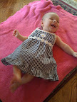 Audrey in a sun dress I bought for her. This is the first actual piece of clothing we purchased for her. I really couldn't help myself as I thought it was about as cute as could be.