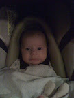 I know this is a dark picture, but this is also one of the funniest pictures I have of her. We were in a restaurant eating away when Audrey woke up in her carrier with this expression on her face. The absolute straight line of her mouth was strangely funny to Melanie and I and she looked this way for about five minutes.