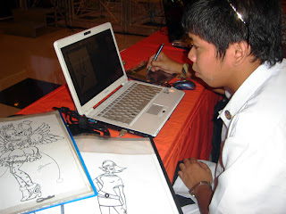 Jerson Bandiola shows his designing skills to visitors.