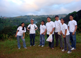 MCCID Santa Claus Team pose on top of future school site (From Left) Joanna Teves, Mark Angelo Reyes, Ariel Quibol, Sir Ervin, Sir Jojo, Jepa Kerena Basilio and Moises Libot