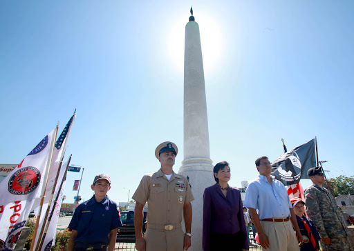 Eastside Memorial Day photo. From left, Cub Scout Jonathan Ruiz, 10, CPO David Jimenez, Congresswoman Judy Chu, LA City Councilman José Huizar, Cub Scout Andrew Ruiz, 7, and PFC Timothy Veloz were the first watch at the 24-hour patriotic vigil at the Mexican All Wars Memorial at Cinco Puntos in Los on Sunday March 30, 2010. 63rd Annual Memorial Day observance and Commemoration of Medal of Honor Recipient PFC Eugene Obregon USMC. The event includes a 24-hour patriotic vigil at the Mexican All Wars Memorial at Cinco Puntos (Intersection of Lorena, Indiana, and Chavez) in Los Angeles. PHOTO BY AURELIO JOSE BARRERA