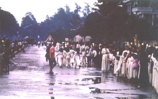payette-129-Parading-through-the-wet-streets-CanTho1965-550x346.jpg