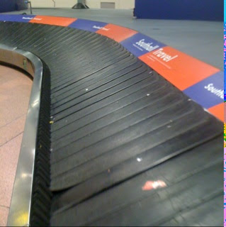 a conveyor belt at an airport