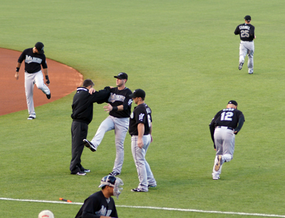 The visiting team stretching and warming up at an angle