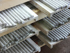 Freshly extruded rods, still soft, ready to be pushed into the iron tubes. Every single rod diameter needs a set of tubes with diameter just a tiny bit bigger.
