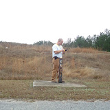 A typical monitoring well. AEM's Field Manager, Eric Benton, enters data in a handheld computer. The electronic data is e-mailed to AEM's project managers to provide quicker QA/QC and report preparation.