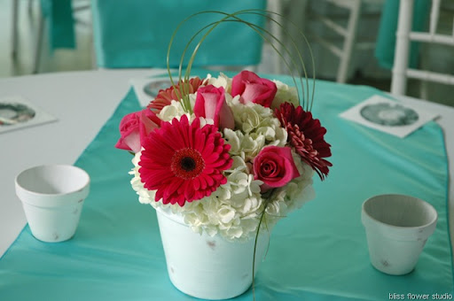 Centerpieces consisted of white hydrangeas'Attach' roses 