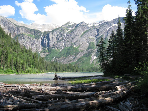 Avalanche Lake. Melting snow above cascading down multiple place to feed lake.