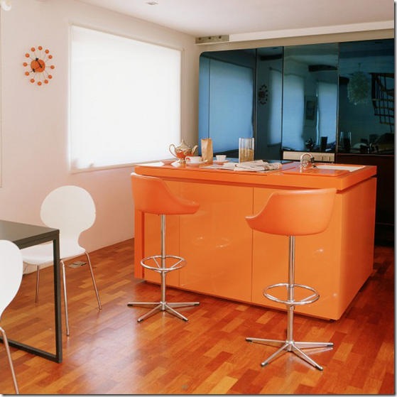 Home: white open plan kitchen/dining room/area; wood flooring orange Corian island unit, sink, leather chrome stools, blue anodized steel storage cupboards. Not used L etc 11/2005 p76. Real home Home: white open plan kitchen/dining room/area; wood flooring orange Corian island unit, sink, leather chrome stools, blue anodized steel storage cupboards. Not used L etc 11/2005 p76. Real home