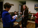 Pam Dibbley shows the book explaining the stained glass picture to Elle LeMoine.