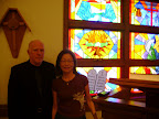 Gene and Amanda Early with the stained glass window commemorating the "Burning Bush"