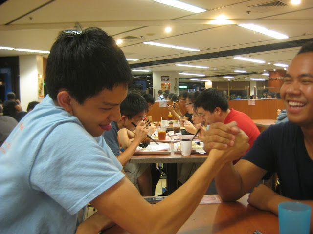 Carson and Chanrith arm wrestling