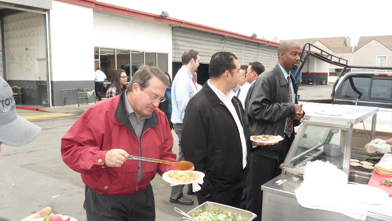 General Manager Darrell Sperber enjoys tacos at a special Service Department BBQ