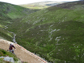 todd's heading down the descent.  eventually we'll meet the stream and follow it into town.