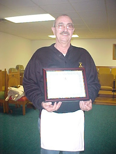 Gene holds his Honorary Membership 
