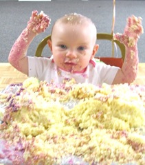 1st birthday party Bella  arms in air cake