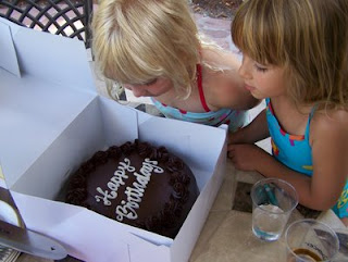 Gwen and Autumn check out the cake that Franchette brought to celebrate all of us turning 40 this year.