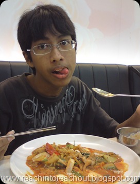Kelvin posing with his food(kimchi)