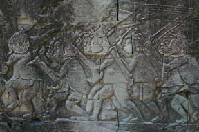 These are the Vietnamese soldiers attacking the Khmer empire, their helmets representing upside down Lotus flowers.